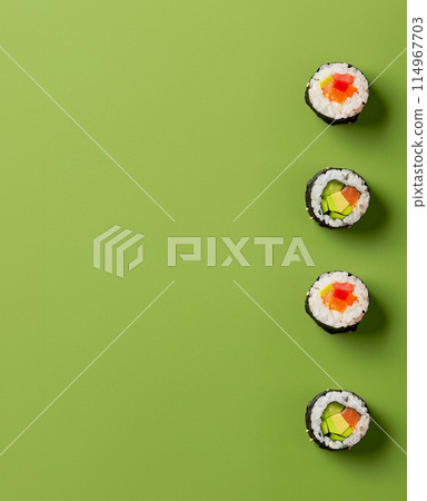 Set of sushi rolls top view over soft green background Set of sushi rolls top view over soft green background 114967703
