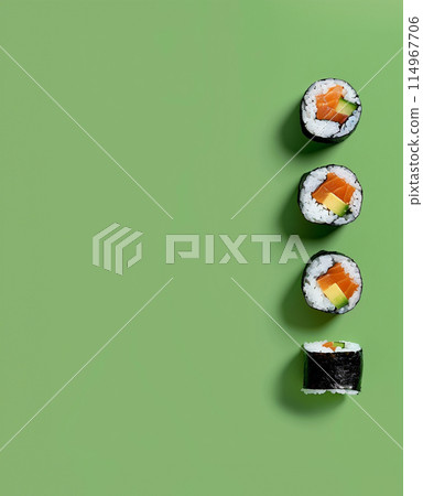 Set of sushi rolls top view over soft green background Set of sushi rolls top view over soft green background 114967706