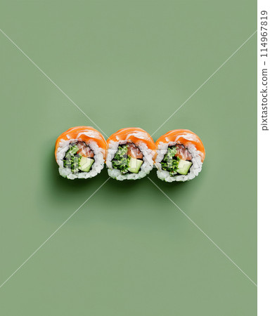 Set of sushi rolls top view over soft green background 114967819