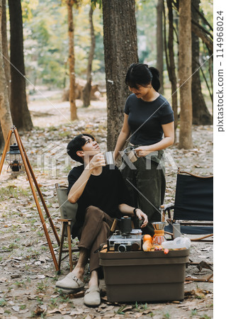 Asian couple sweet in tent inside on they camping trip, traveller relax and sleep togather in out door and camping trip 114968024