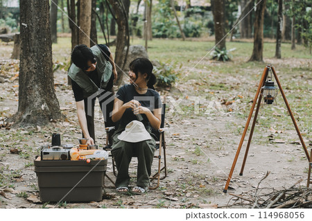 Asian couple sweet in tent inside on they camping trip, traveller relax and sleep togather in out door and camping trip Asian couple sweet in tent inside on they camping trip, traveller relax and sleep togather in out door and camping trip 114968056