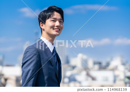 Young businessman working in the city Young businessman working in the city 114968139