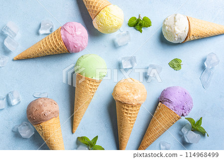 Various ice cream scoops in cones 114968499