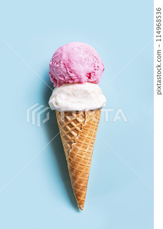 Ice Cream Scoops in Cone on blue background 114968536