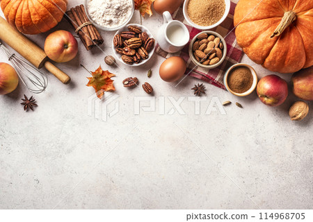 Autumn baking background with pumpkins, apples and nuts 114968705