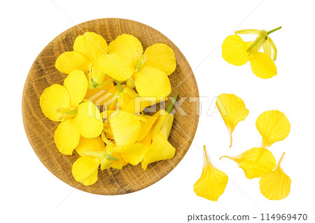 Rapeseed flowers in wooden bowl isolated on white background, Top view. Flat lay 114969470