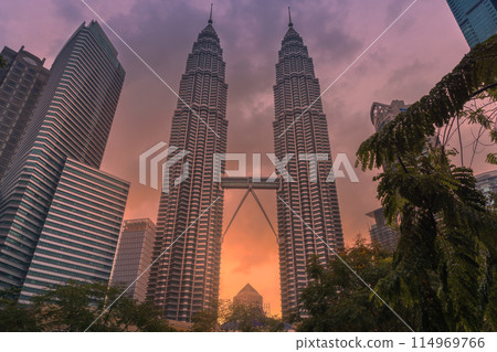 May 25, 2024. Kuala Lumpur, Malaysia. Petronas skyscrapers with sunset. Twin towers in KL center. May 25, 2024. Kuala Lumpur, Malaysia. Petronas skyscrapers with sunset. Twin towers in KL center. 114969766