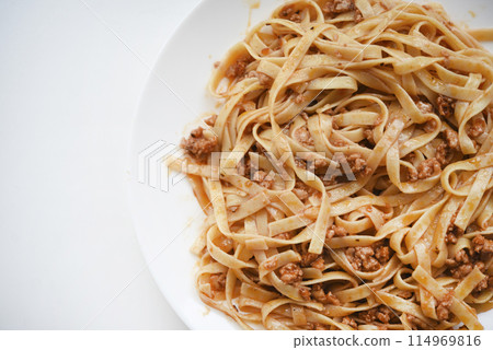 Pasta with meat on a plate. Delicious noodles with meat. Italian cuisine. Pasta with meat on a plate. Delicious noodles with meat. Italian cuisine. 114969816