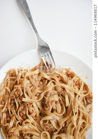 Pasta with meat on a plate. Delicious noodles with meat. Italian cuisine. Pasta with meat on a plate. Delicious noodles with meat. Italian cuisine. 114969817