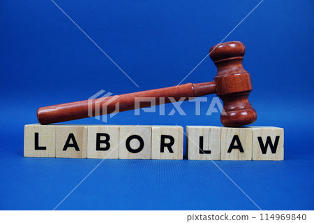 Labor Law alphabet letters with wooden blocks alphabet letters and Gavel on blue background Labor Law alphabet letters with wooden blocks alphabet letters and Gavel on blue background 114969840