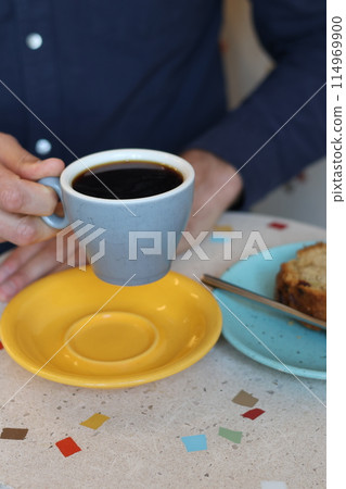 cup of coffee or tea and dessert in coffee shop or restaurant. Drink fragrant black drink during break. 114969900