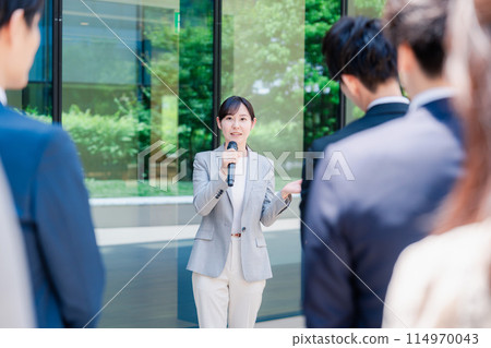 Woman speaking with a microphone Woman speaking with a microphone 114970043