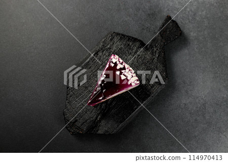 Blueberry cheesecake. On a black background 114970413