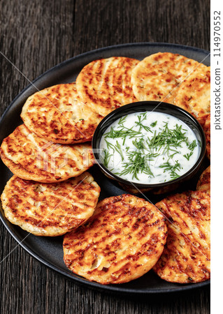 baked cottage cheese parmesan pancakes on plate 114970552