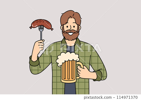 Man with mug of beer in hands and Bavarian sausage smiles, visiting pub to relax after working week 114971370