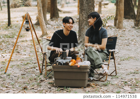 Asian couple sweet in tent inside on they camping trip, traveller relax and sleep togather in out door and camping trip 114971538