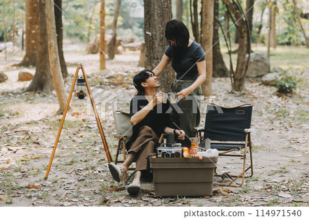 Asian couple sweet in tent inside on they camping trip, traveller relax and sleep togather in out door and camping trip 114971540