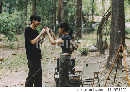 Asian couple sweet in tent inside on they camping trip, traveller relax and sleep togather in out door and camping trip 114971551