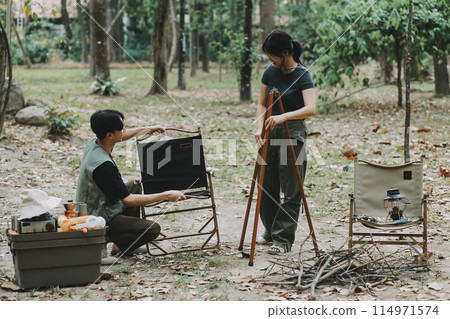 Asian couple sweet in tent inside on they camping trip, traveller relax and sleep togather in out door and camping trip 114971574