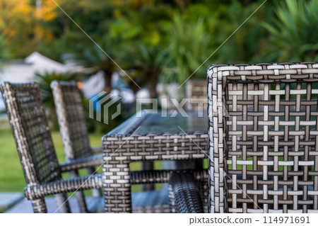 Glamping scene of enjoying a luxurious barbecue on the terrace of a cottage 114971691