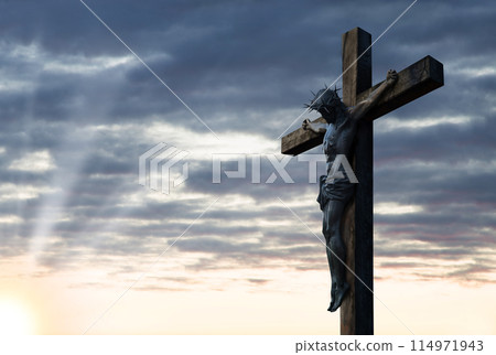 Crucified Christ hangs on the cross 114971943