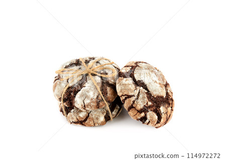Chocolate cookies in powdered sugar isolated on a white background. Christmas Time. Chocolate cookies in powdered sugar isolated on a white background. Christmas Time. 114972272