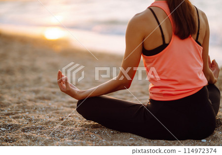 Sport woman doing exercises outdoors. Woman doing stretching. Sport, Active life, sports training. 114972374