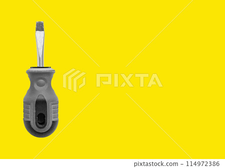 Screwdriver and background, metallic yellow tool and white instrument design. Office blade cut 114972386