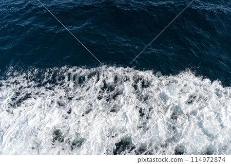 Ripples left behind after a ship passes Ripples left behind after a ship passes 114972874