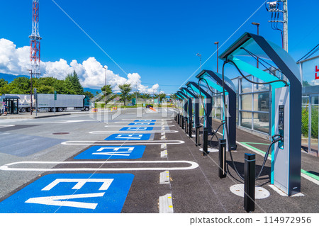 An electric vehicle charging station installed at a highway parking area 114972956