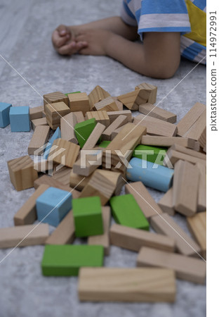 Children wooden blocks parts for game.Board game concept .Entertaining games for children.Kindergarden education games.close up view Children wooden blocks parts for game.Board game concept .Entertaining games for children.Kindergarden education games.close up view 114972991