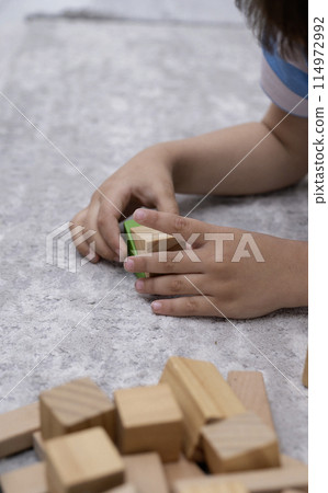 Children wooden blocks parts for game.Board game concept .Entertaining games for children.Kindergarden education games.close up view Children wooden blocks parts for game.Board game concept .Entertaining games for children.Kindergarden education games.close up view 114972992