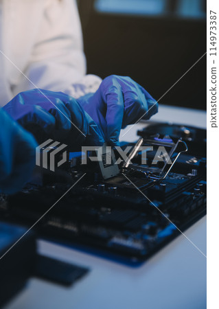 Close up of Technician measuring voltage electronic circuit board television, Service after sale fix electric equipment within insurance. Close up of Technician measuring voltage electronic circuit board television, Service after sale fix electric equipment within insurance. 114973387
