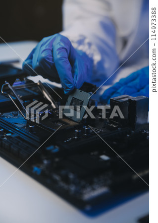Close up of Technician measuring voltage electronic circuit board television, Service after sale fix electric equipment within insurance. Close up of Technician measuring voltage electronic circuit board television, Service after sale fix electric equipment within insurance. 114973388