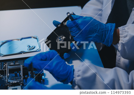 Close up of Technician measuring voltage electronic circuit board television, Service after sale fix electric equipment within insurance. Close up of Technician measuring voltage electronic circuit board television, Service after sale fix electric equipment within insurance. 114973393