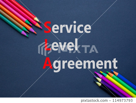 SLA service level agreement symbol. Concept words SLA service level agreement on black paper. Beautiful black background. Colored pencils. Business SLA service level agreement concept. Copy space. SLA service level agreement symbol. Concept words SLA service level agreement on black paper. Beautiful black background. Colored pencils. Business SLA service level agreement concept. Copy space. 114973793