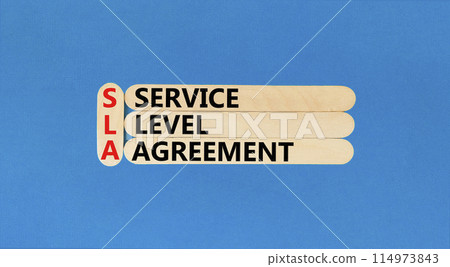 SLA service level agreement symbol. Concept words SLA service level agreement on beautiful wooden stick. Beautiful blue background. Business SLA service level agreement concept. Copy space. 114973843