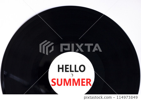 Hello summer symbol. Concept words Hello summer on beautiful white black vinyl disk. Beautiful white paper background. Business lifestyle Hello summer concept. Copy space. Hello summer symbol. Concept words Hello summer on beautiful white black vinyl disk. Beautiful white paper background. Business lifestyle Hello summer concept. Copy space. 114973849