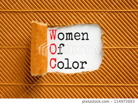 WOC women of color symbol. Concept words WOC women of color on beautiful white paper. Beautiful brown paper background. Business WOC women of color social issues concept. Copy space. 114973883