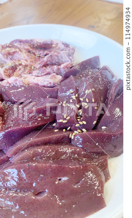 Yakiniku menu: Large serving of fresh raw meat on a plate Yakiniku menu: Large serving of fresh raw meat on a plate 114974934