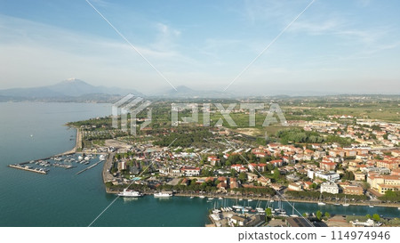Aerial view of the city of Peschiera del Garda, Italy. Beautiful view from a drone of the city, lake and mountains 114974946