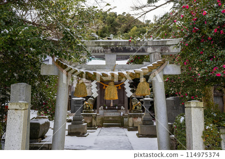 Snowy winter view of small local shinto shrine in Kanazawa, Japan. Snowy winter view of small local shinto shrine in Kanazawa, Japan. 114975374