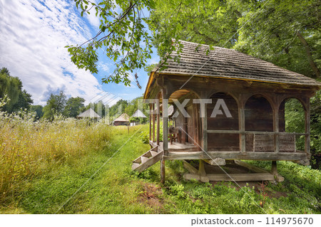 Amazing summer scene of traditional romanian peasant houses. Amazing summer scene of traditional romanian peasant houses. 114975670