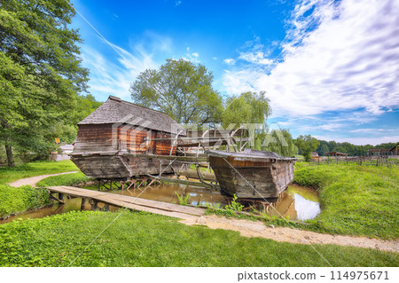 Amazing summer view of traditional romanian windmill. Amazing summer view of traditional romanian windmill. 114975671