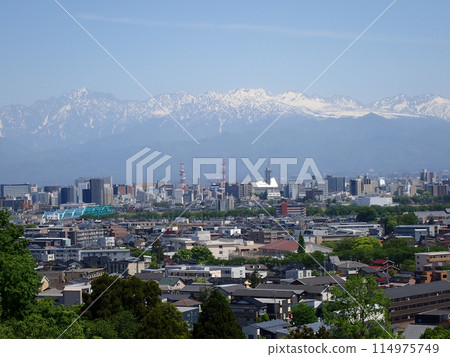 Fresh greenery on Mt. Kureha in May. View of Mt. Tsurugi, Mt. Tateyama mountain range and Toyama city from the promenade suspension bridge over Toyama Prefectural Route 44 Toyama Takaoka Line. 114975749