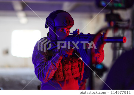 A professional cameraman captures the intense moments as a group of skilled soldiers embarks on a dangerous mission inside an abandoned building, their actions filled with suspense and bravery 114977911