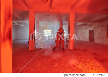 A group of professional soldiers bravely executes a dangerous rescue mission, surrounded by fire in a perilous building. A group of professional soldiers bravely executes a dangerous rescue mission, surrounded by fire in a perilous building. 114977963