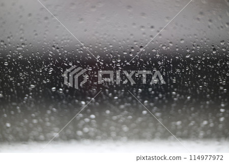 Water drops on fogged glass with a gray brightness gradient 114977972