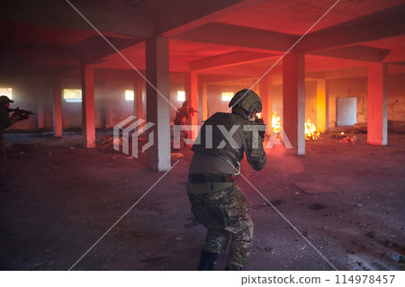 A group of professional soldiers bravely executes a dangerous rescue mission, surrounded by fire in a perilous building. A group of professional soldiers bravely executes a dangerous rescue mission, surrounded by fire in a perilous building. 114978457