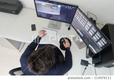 professional video editor enhancing digital footage using specialized software professional video editor enhancing digital footage using specialized software 114979111